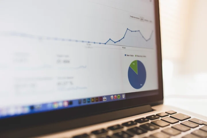 Laptop screen showing an analytics dashboard with a line chart