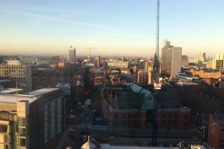 Manchester city centre rooftops and skyline at golden hour