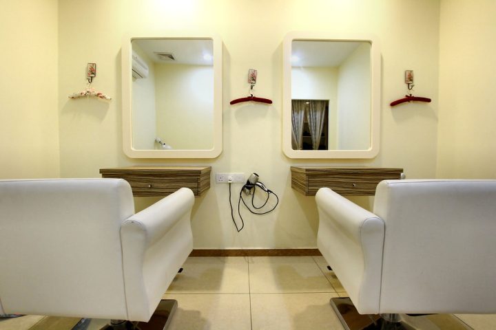 Empty styling chairs and mirrors in a clinic room